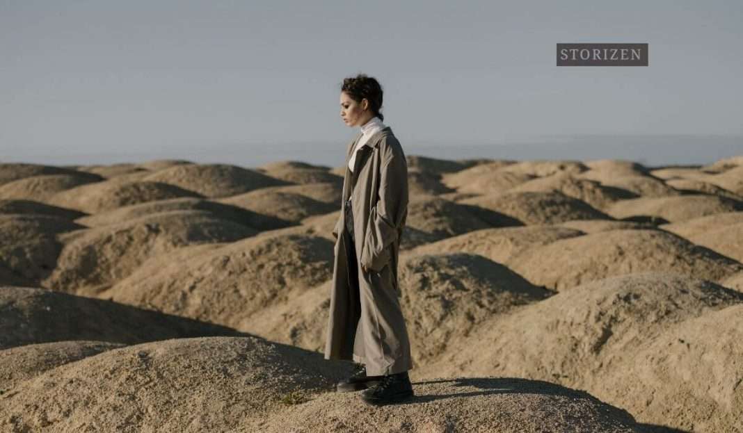 woman standing in a desert