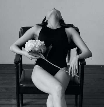 woman-sitting-in-an-erotic-pose