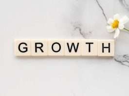 growth written with scrabble tiles success