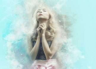 girl with joined hands and praying with faith