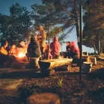 group-of-people-near-bonfire-near-trees-during-nighttime-1